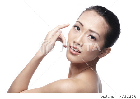 Beautiful Asian woman gently touching her face. Beautiful Asian woman gently touching her face. 7732256