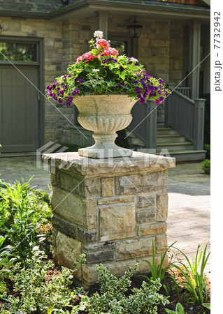 Stone planter in front of house Stone planter in front of house 7732942