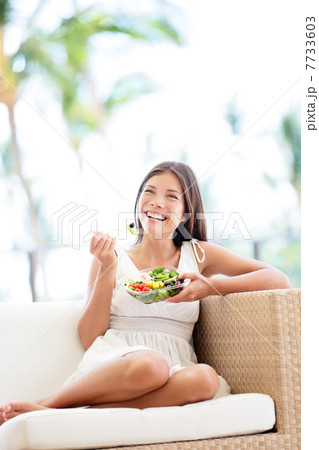 Healthy lifestyle woman eating salad smiling happy 7733603