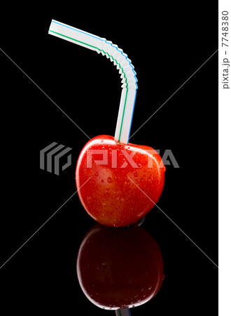 Ripe cherry with cocktail straw Ripe cherry with cocktail straw 7748380