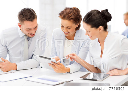 business team working with tablet pcs in office business team working with tablet pcs in office 7756503