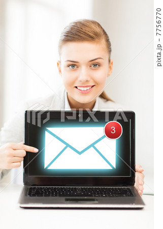 businesswoman with laptop in office businesswoman with laptop in office 7756770