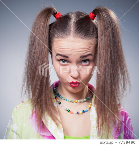 teen girl make faces with kiss looking at camera teen girl make faces with kiss looking at camera 7759490