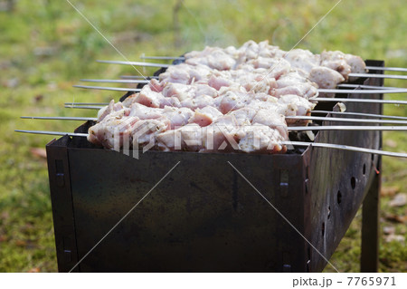 cooking pork shashlik  on skewer 7765971