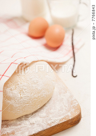 Dough on wooden board Dough on wooden board 7766843