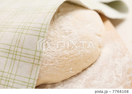 Dough on wooden board Dough on wooden board 7768108