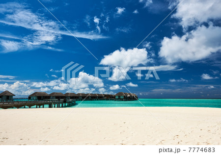 Beautiful beach with water bungalows 7774683