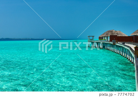 Beautiful beach with water bungalows 7774702