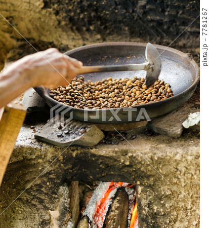 Coffee beans are roasting in pan. Traditional techniques 7781267