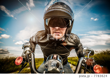 Biker racing on the road 7783624