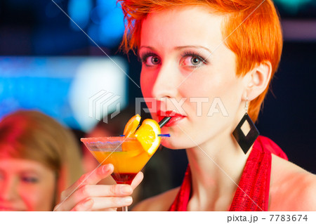 People in club or bar drinking cocktails 7783674