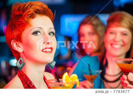 People in club or bar drinking cocktails 7783677