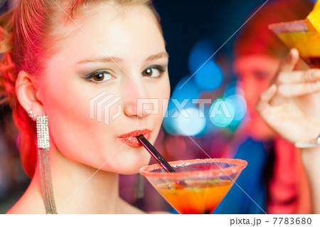 People in club or bar drinking cocktails 7783680