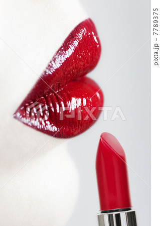Female lips and lipstick. Vertical shot. 7789375
