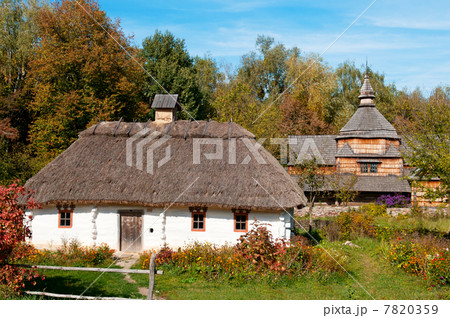 Old wooden house and a wooden Orthodox Church 7820359