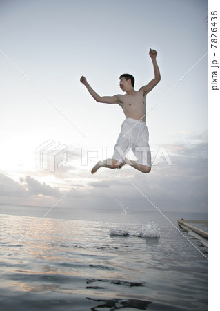 Young man jumping from water Young man jumping from water 7826438