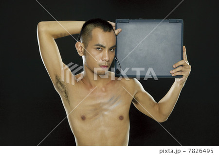 Young woman holding a notebook computer 7826495