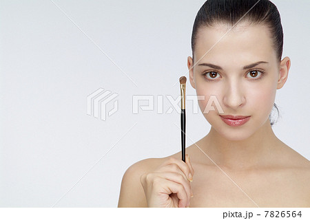 Young woman holding an eyebrows brush 7826564