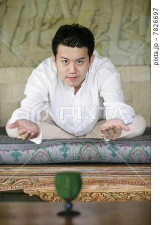 Young man practising Qigong 7826697