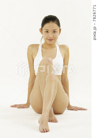 Young woman sitting 7826771