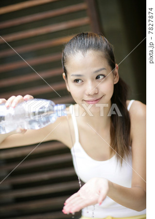 Young woman emptying bottle 7827874