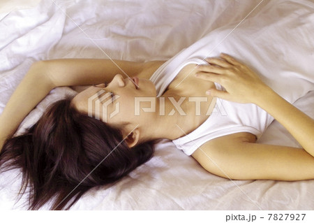 High angle view of woman lying in bed High angle view of woman lying in bed 7827927