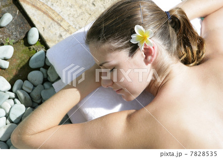 Woman enjoying sunbathing Woman enjoying sunbathing 7828535
