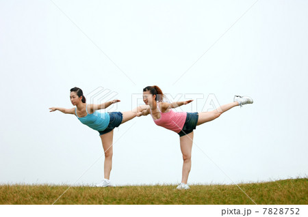 Two young women practising Gymnastics 7828752