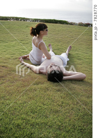 Young couple lying on grass Young couple lying on grass 7828770
