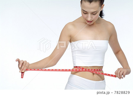 Portrait of young woman wearing sports clothing Portrait of young woman wearing sports clothing 7828829