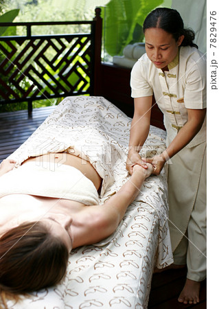 Woman receiving massage Woman receiving massage 7829476