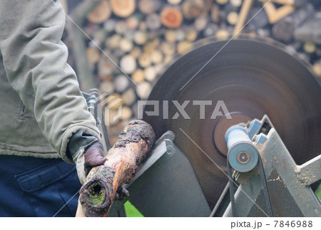 Man sawing wood on the circular saw. 7846988