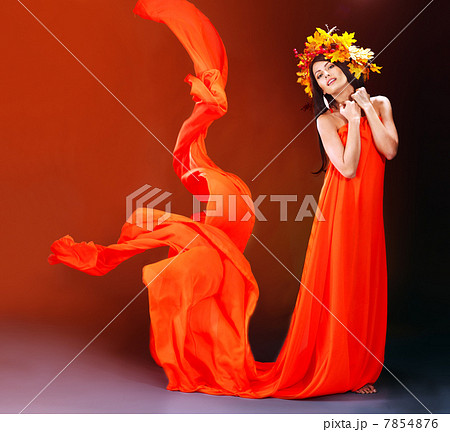 Girl with a wreath of autumn leaves on the head. 7854876