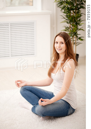 Woman sitting on floor Woman sitting on floor 7859155