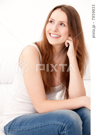 woman sitting on sofa 7859833