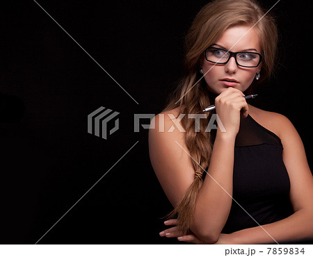 woman thinking, planning with pen 7859834