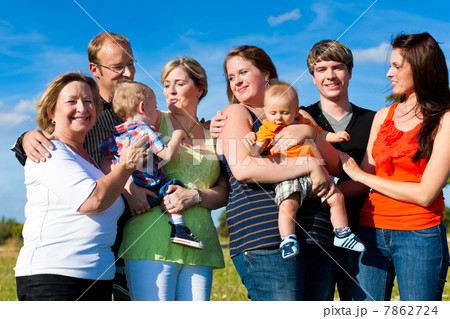 Family and multi-generation - fun on meadow in summer 7862724