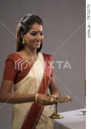 Woman offering prayers  7870279