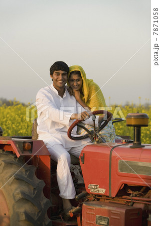 A rural couple on a tractor A rural couple on a tractor 7871058