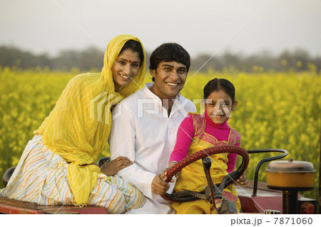 A typical rural family on a tractor  7871060
