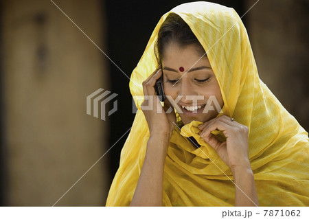 Rural woman talking on a mobile Rural woman talking on a mobile 7871062