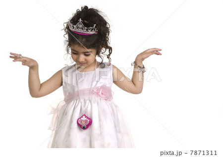 A girl in a party dress and tiara A girl in a party dress and tiara 7871311