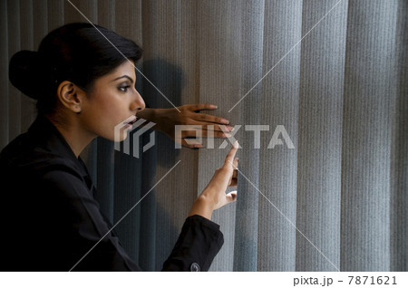 Executive peeking out the window Executive peeking out the window 7871621