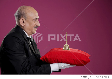 Butler carrying a bell  7871764
