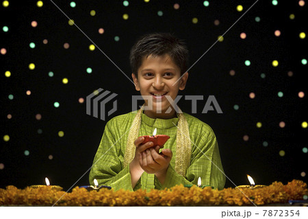 Boy holding Diya Boy holding Diya 7872354