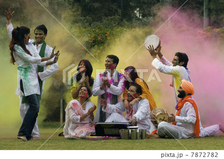 Family celebrating Holi  7872782