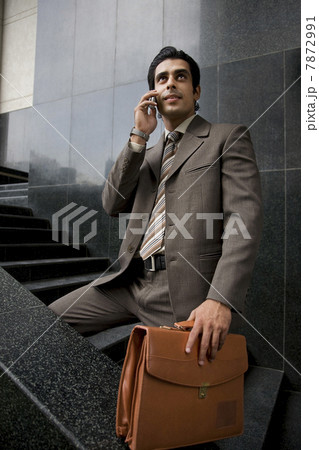 Executive talking on his phone Executive talking on his phone 7872991