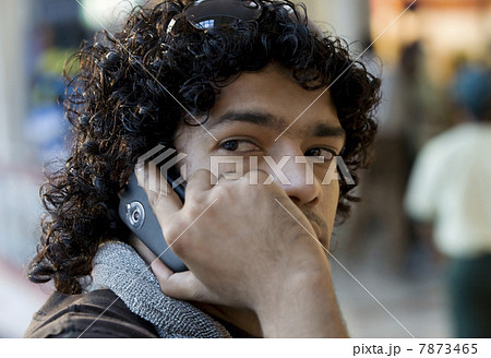 Man talking on his mobile phone  7873465