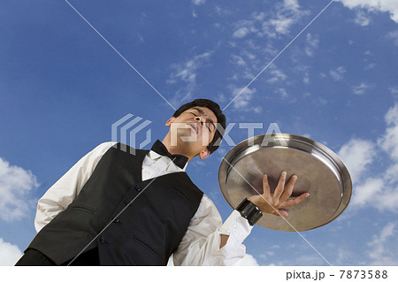 Butler holding a tray  7873588