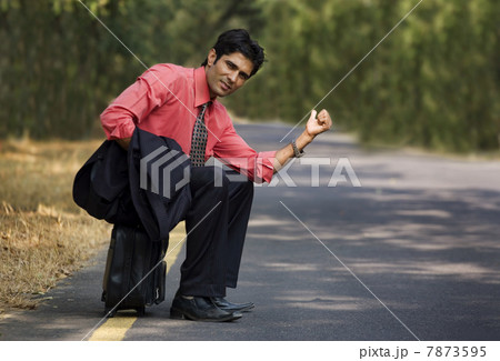 Businessman seeking a lift Businessman seeking a lift 7873595